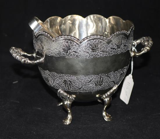 A silver plated two handled ice bucket and a pair of tongs, height 6.25in.